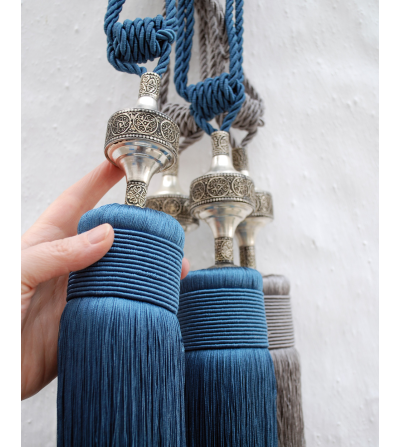 Small Moroccan tassels and curtain tie backs with hand engraved oriental motif